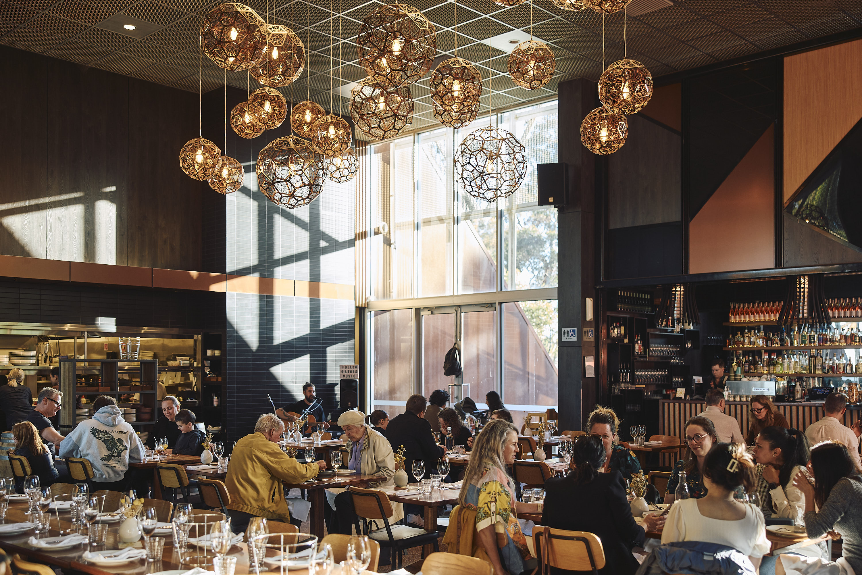 long table of people dining inside Shadowfax Winery