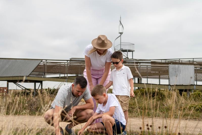 family looking at grassland at Cheetham Wetlands