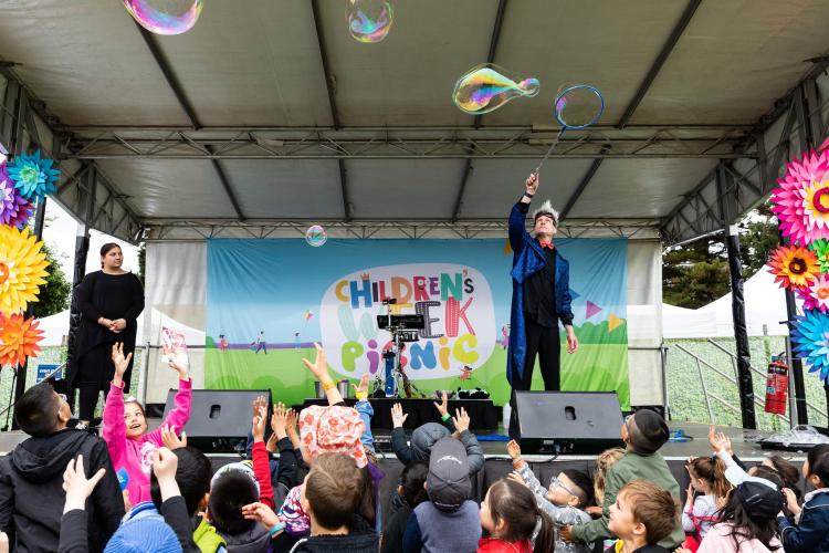 Performer blowing bubbles on stage